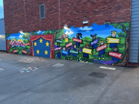 Graffiti artist helps pupils create mural for Powys school