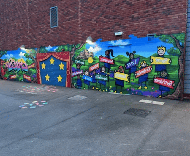 Graffiti artist helps pupils create mural for Powys school