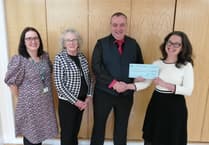 Show committee donates to cancer support charity