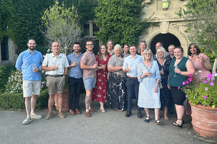 The employees with 10 or more years of service at the annual meal at Llangoed Hall in September