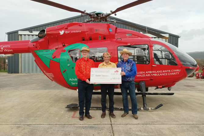 The Radnor Twurzels presenting a cheque to the Wales Air Ambulance