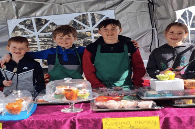 Left to right: George, Harry, Henry and Amelia at their cake stall in Builth Wells