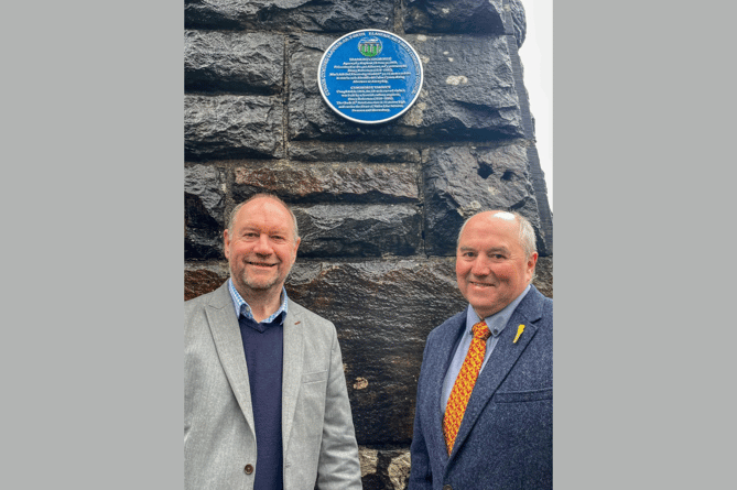 Cefin Campbell MS (left) and Cllr Handel Davies in front of the blue plaque