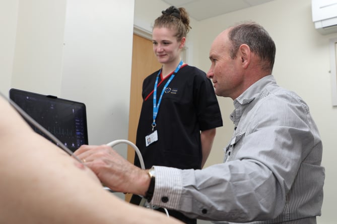 Dr Graham Thomas and Advanced Cardiac Physiologist Sian Evans carry out a echocardiogram on a patient at the Montgomery County Infirmary at Newtown.
