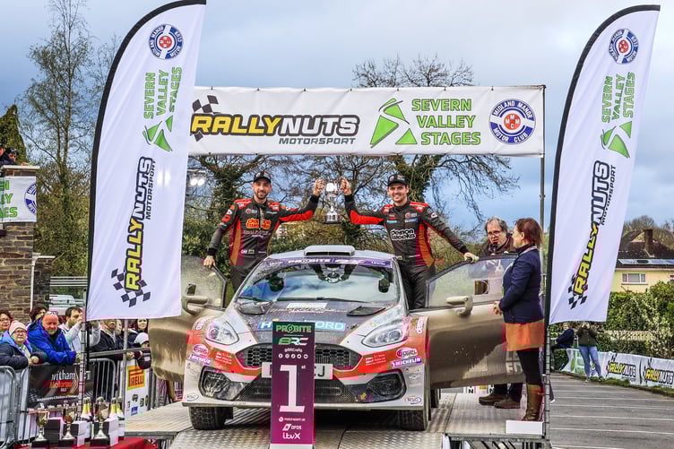 Osian Pryce and Rhodri Evans celebrate victory outside the Metropole Hotel in Llandrindod Wells (Mark Griffin)