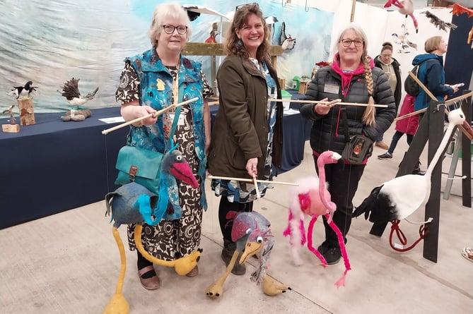 Janna Turner (centre) with Alex Johnstone (left) and Deborah Taylor Dyer with bird marionettes on the Flock2Flight display.
 