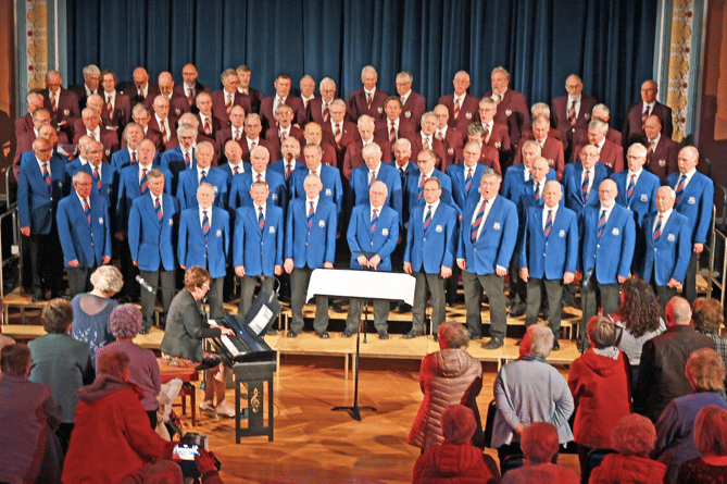 Builth (in blue) and Reading male voice choirs in performance together in Llandrindod Wells.png