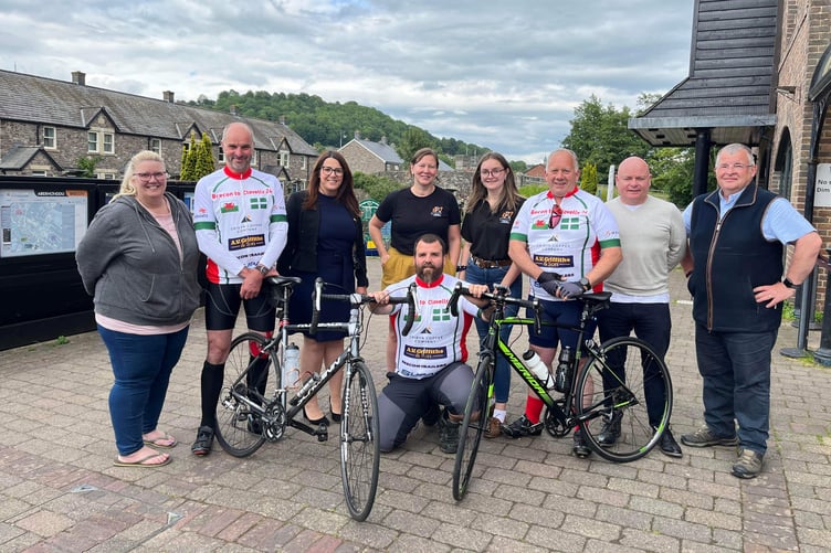 Three members of the team pose for a photo at Brecon Canal Basin