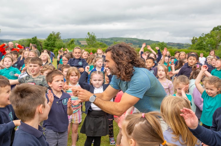 Fitness Coach Joe Wicks with schoolchildren from Ysgol Trefonnen.