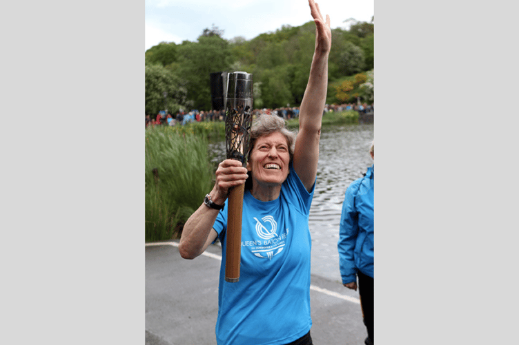 Kirsty Wade with the Queen's Baton at Llandrindod Lake in 2014