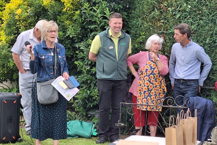 Members of the judging panel, whilst Rosie Williams announces the winner