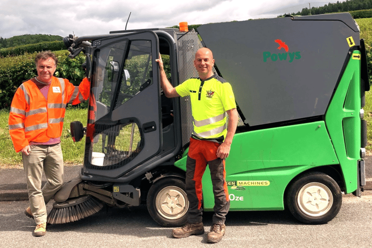 Powys County Council Highways Inspector, Vincent Playdon, and Brecon Town Council’s Caretaker, Alex Jones with the small electric road sweeper.