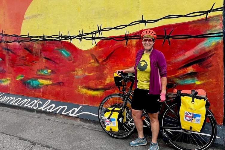 Taniya at the Berlin Wall. The mural is “Niemandsland” (No man’s land) in the East Side Gallery