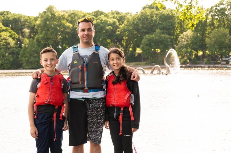 Kevin Hughes from Llanwrtyd Wells with his children Isla and Charlie. Llandrindod Lake is behind.