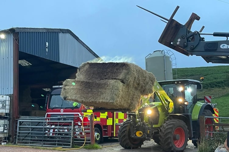 The dangerous bales being removed from the farm at Builth Wells