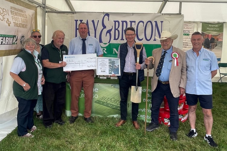 The raffle for the spade has raised £600 for The Royal Agricultural Benevolent Institution