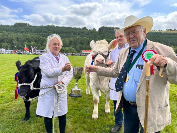 The President, Mr Frank Sutton and Annie Lewis with her prize-winning commercial heifer “Miss Dior”