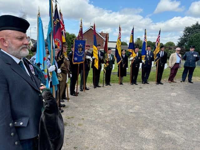 Piper and standards at St Martin's, Hereford