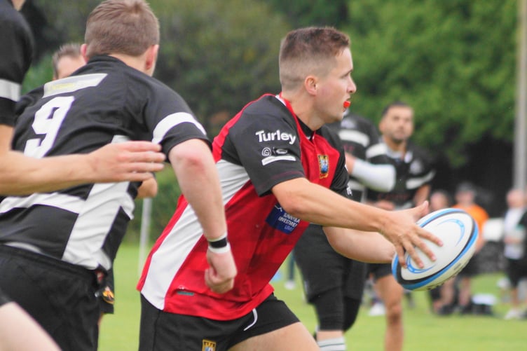 Dafydd Edwards gets the ball away to his support out wide
