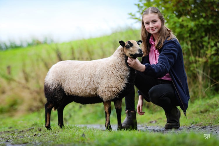 Setting a new ewe lamb record were Matthew and Donna Evans with their pre-sale show champion.