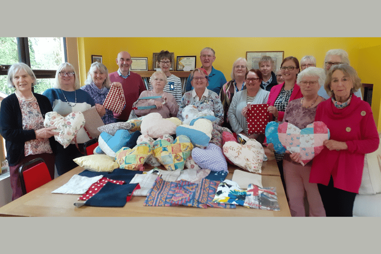 The Bracken Trust representatives pictured with guests and the WI craft members, with their donations