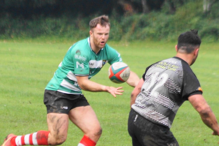 Sam Jones looks for work in midfield