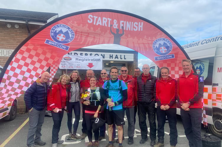 The happy couple, Anna & Sam, who got engaged out on the course (front and centre) pictured with Brecon Mountain Rescue Team volunteers and VIP ambassador, Kate Humble.