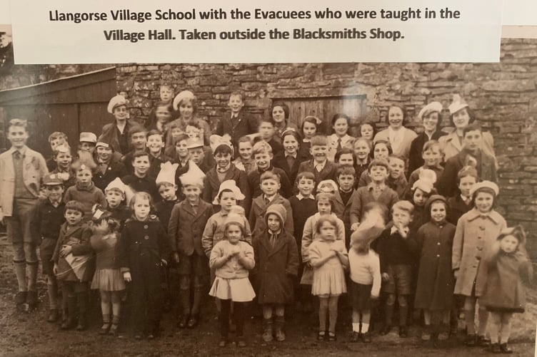 Llangorse Village School with the Evacuees who were taught in the Village Hall, taken outside the Blacksmiths Shop