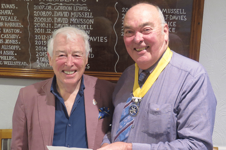 Drewe Lacey receiving a cheque from Rotary Vice President, Hugh Garner