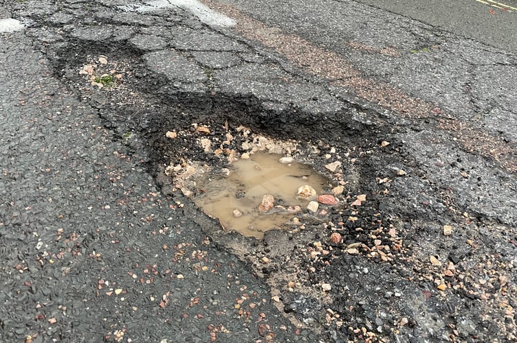 Pothole filled with rainwater