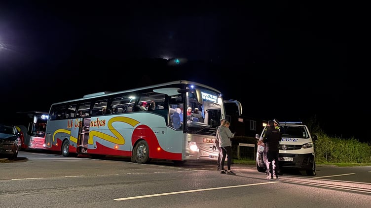 The two rail replacement coaches waiting at Dolfach to take passengers from the wreckage to their final destinations.