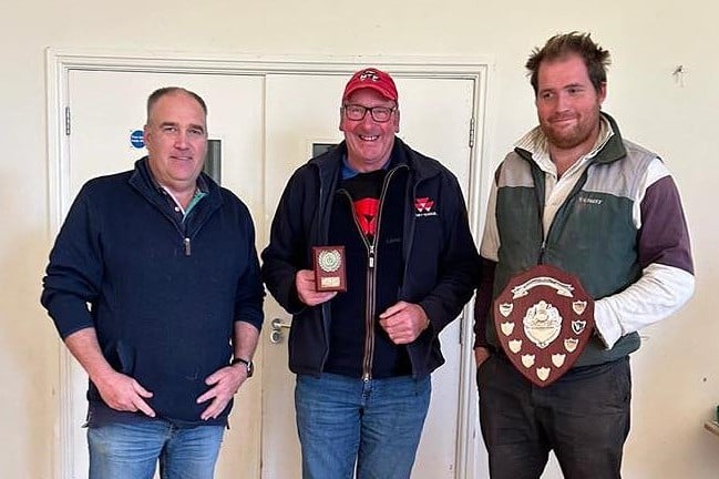 Dave Evans receiving the Ron Meredith Memorial Shield from Sam Ritchie and Andrew Ritchie