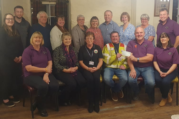 A cheque for £1,500 presented to Blood Bike Wales by the Penybont Tractor Run Charity Group