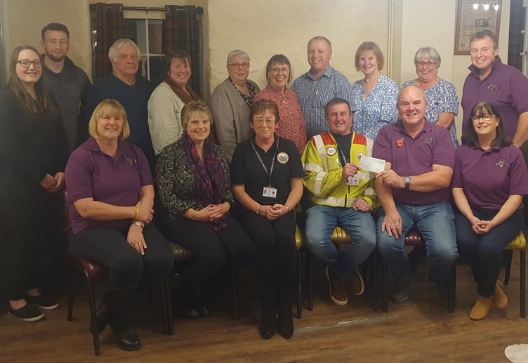 A cheque for £1,500 presented to Blood Bike Wales by the Penybont Tractor Run Charity Group