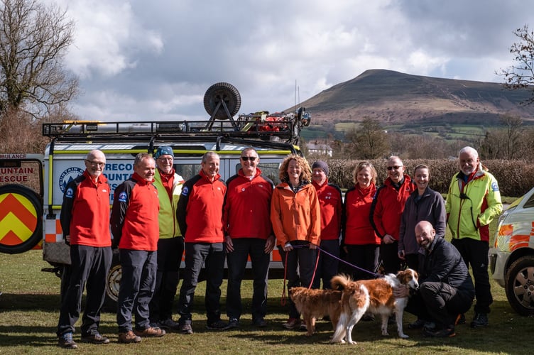 Brecon Mountain Rescue Team members with Ambassador, Kate Humble - accompanied by the Black Mountains in the background.   