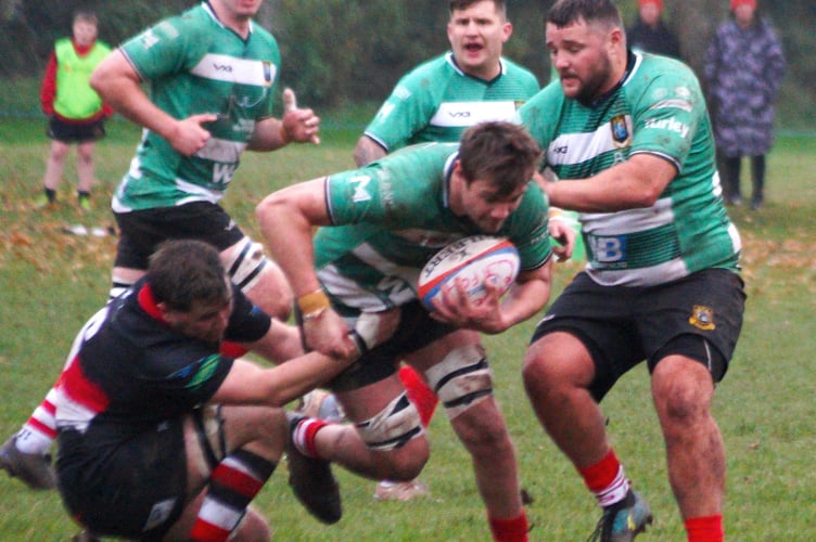 Callum Bradbury carries the ball hard at the Llangennech defence