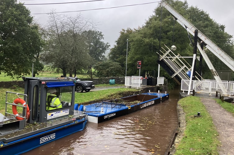 Glandŵr Cymru workers dredge sediment from the Monmouthshire & Brecon Canal