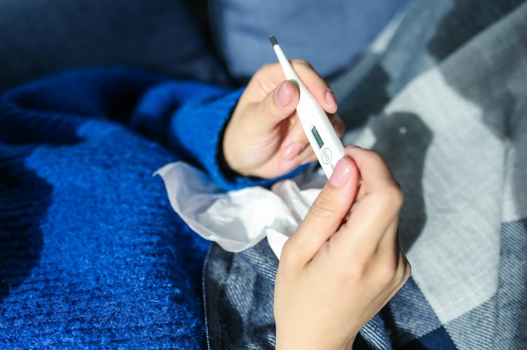Powys Teaching Health Board is urging hospital visitors to stay away if unwell, amid rising flu cases