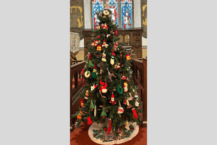 A beautifully adorned Christmas tree featuring handmade decorations created by WI members