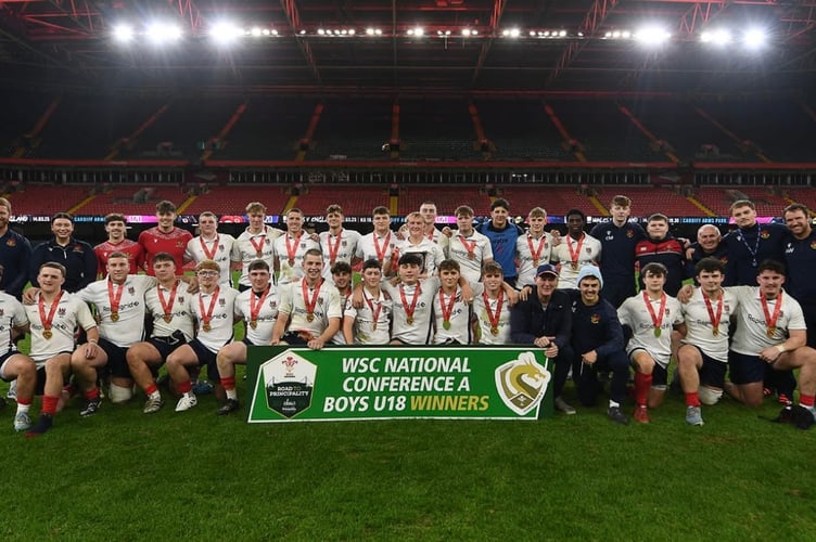 The victorious Llandovery College team celebrates after retaining their Welsh Schools and Colleges U18 title at the Principality Stadium
