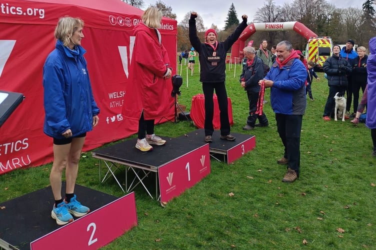 Annabel Harford celebrating her medal at Newtown