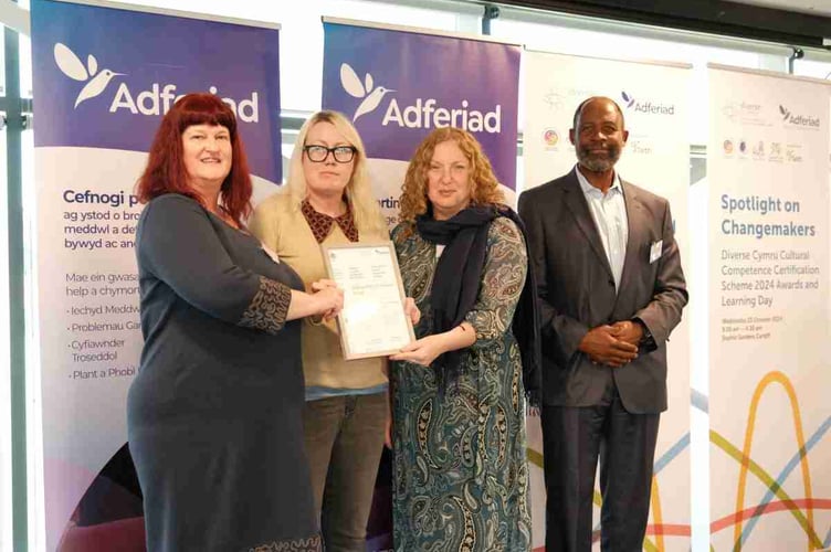 Representatives from Mid & North Powys Mind receiving the Silver Diverse Cymru award at a ceremony in Cardiff