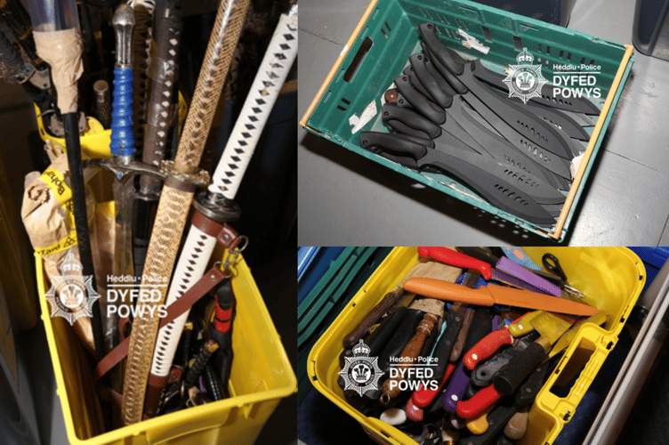 A collection of knives, including samurai swords, machetes, and daggers, destroyed as part of a new initiative to combat knife crime in Dyfed-Powys