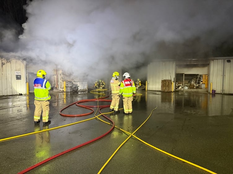 Fire crews are tackling a fire at an industrial estate in Welshpool