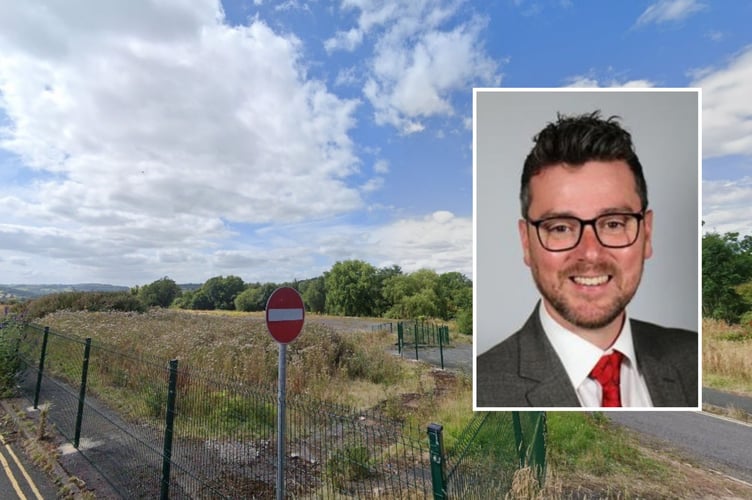 Cllr Matthew Dorrance. Behind is the site of the former Brecon High School at Penlan in Brecon