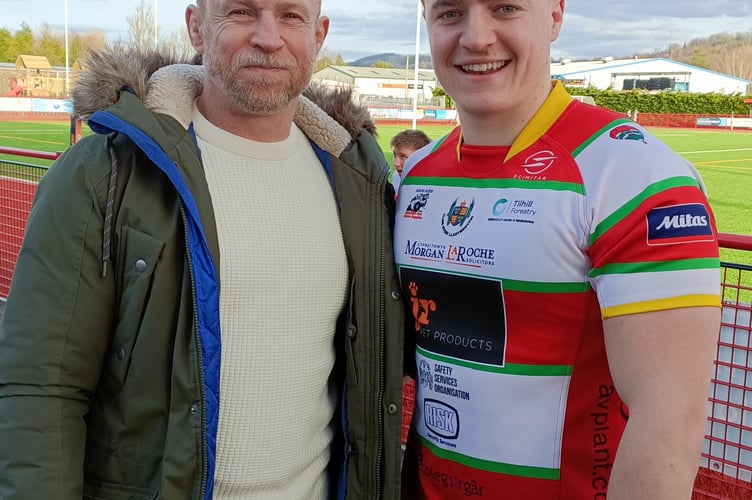 LLANDOVERY SCRUM HALF AND TRY SCORER GEORGE MACDONALD PICTURED WITH FATHER AND EX SWANSEA SCRUM HALF CHRIS.