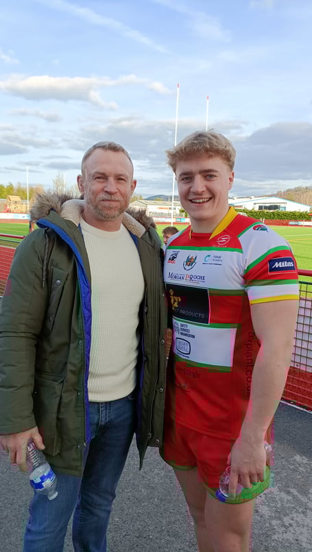 LLANDOVERY SCRUM HALF AND TRY SCORER GEORGE MACDONALD PICTURED WITH FATHER AND EX SWANSEA SCRUM HALF CHRIS.