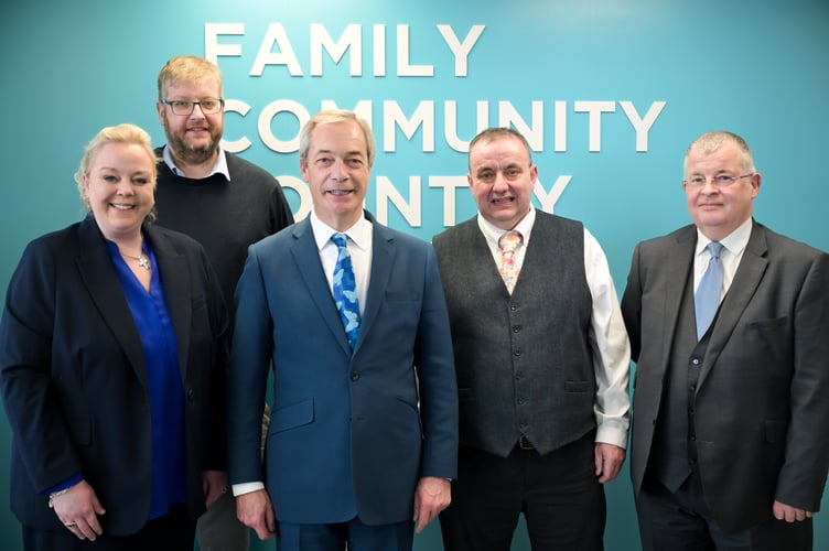Nigel Farage MP, Leader of Reform UK, with the four Powys county councillors who have joined the party today