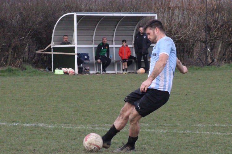 Callum Matthew scoring the winning penalty
