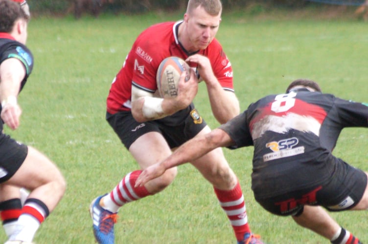 Jack Dixon draws the Llangennech defence